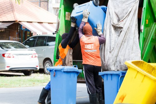 Satisfied homeowner enjoying a clean garden post waste removal